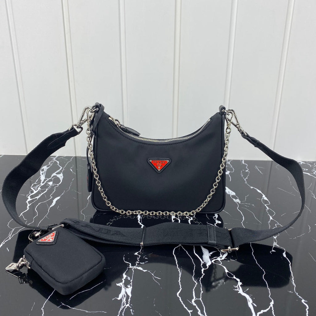 PRADA HOBO 22 BAG IN BLACK RE-NYLON WITH RED LOGO