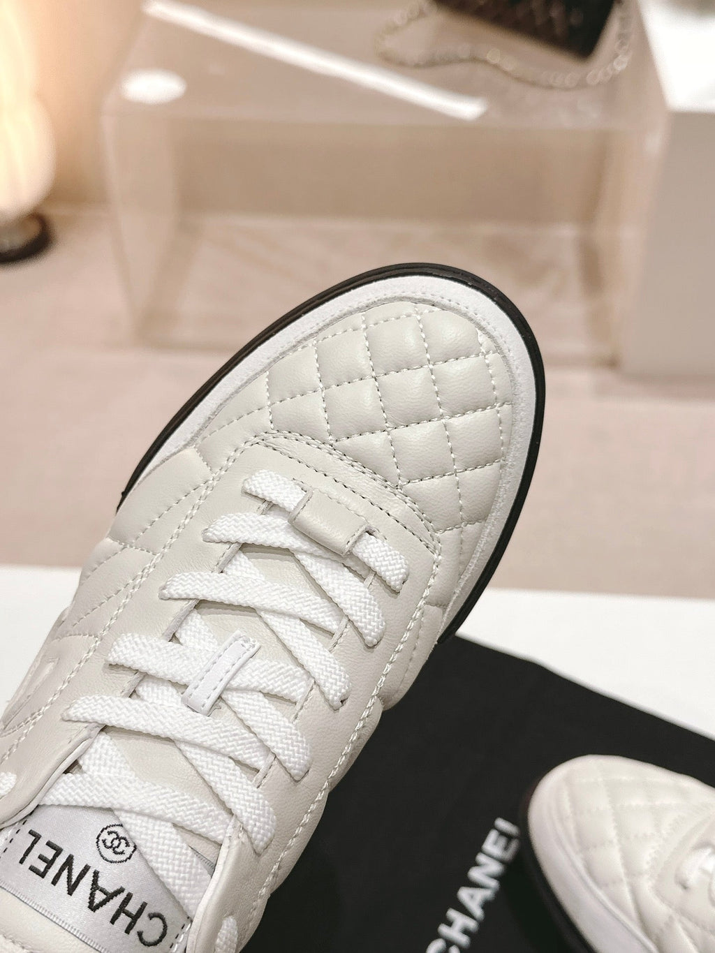 CHANEL SNEAKERS IN GLOSSY WHITE LAMBSKIN