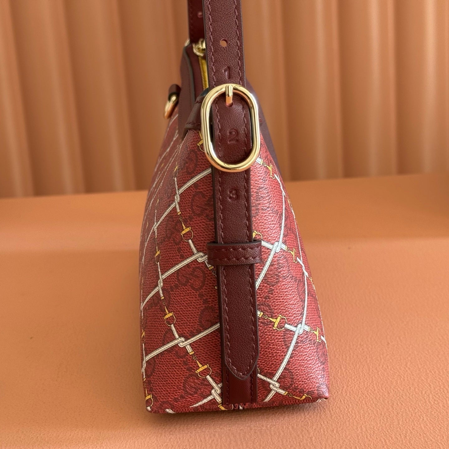 GUCCI 26S  EMBLEM BUCKET BAG 22 IN DARK RED COATED FABRIC