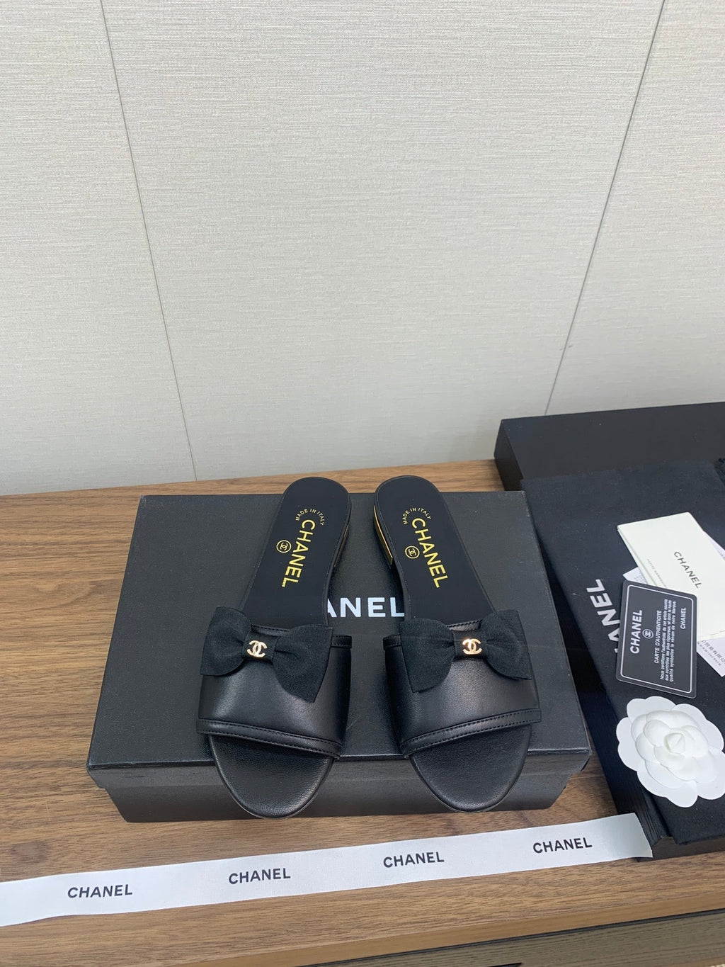 CHANEL BOW SLIPPERS IN BLACK LAMBSKIN