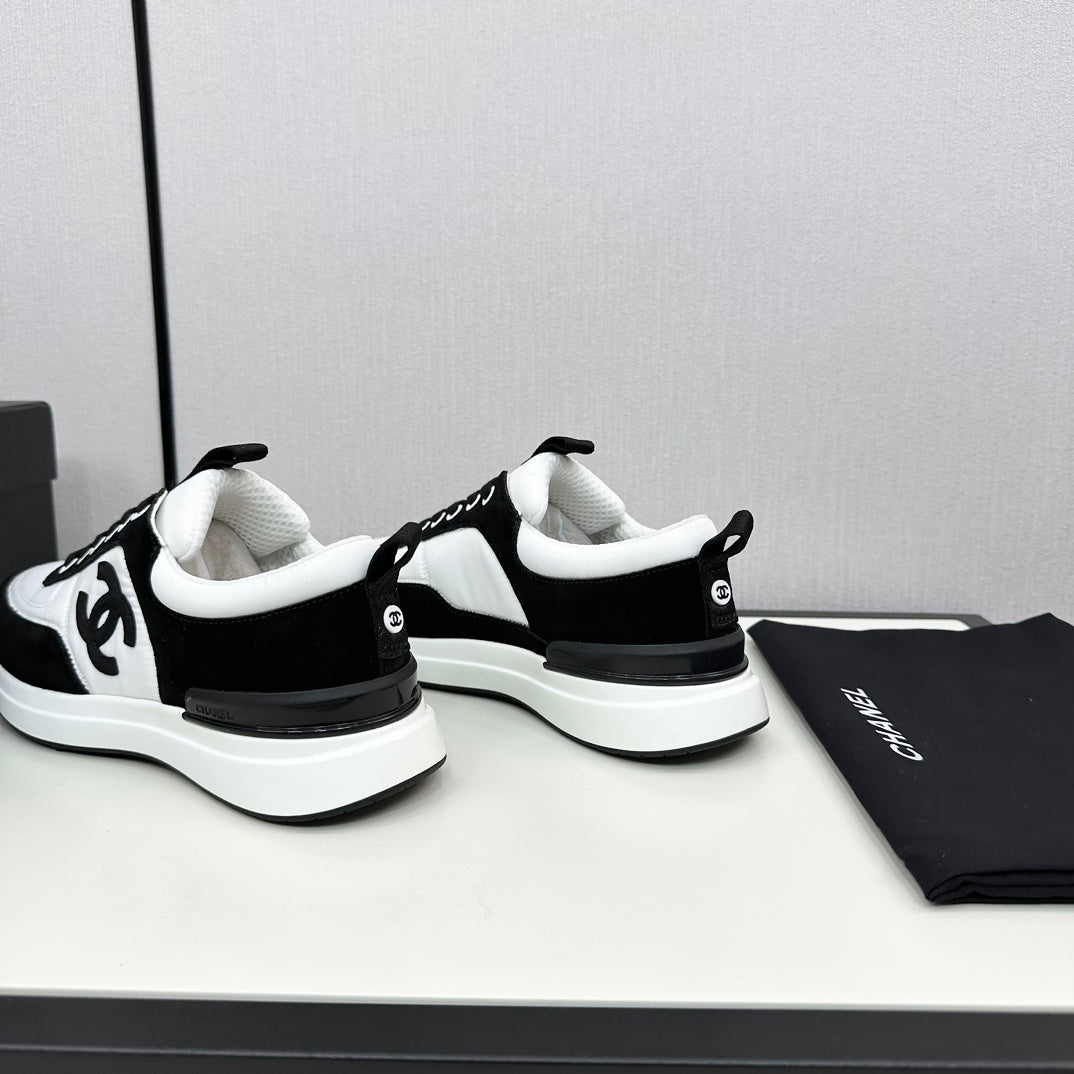 CHANEL SNEAKER IN BLACK SUEDE AND WHITE CALFSKIN